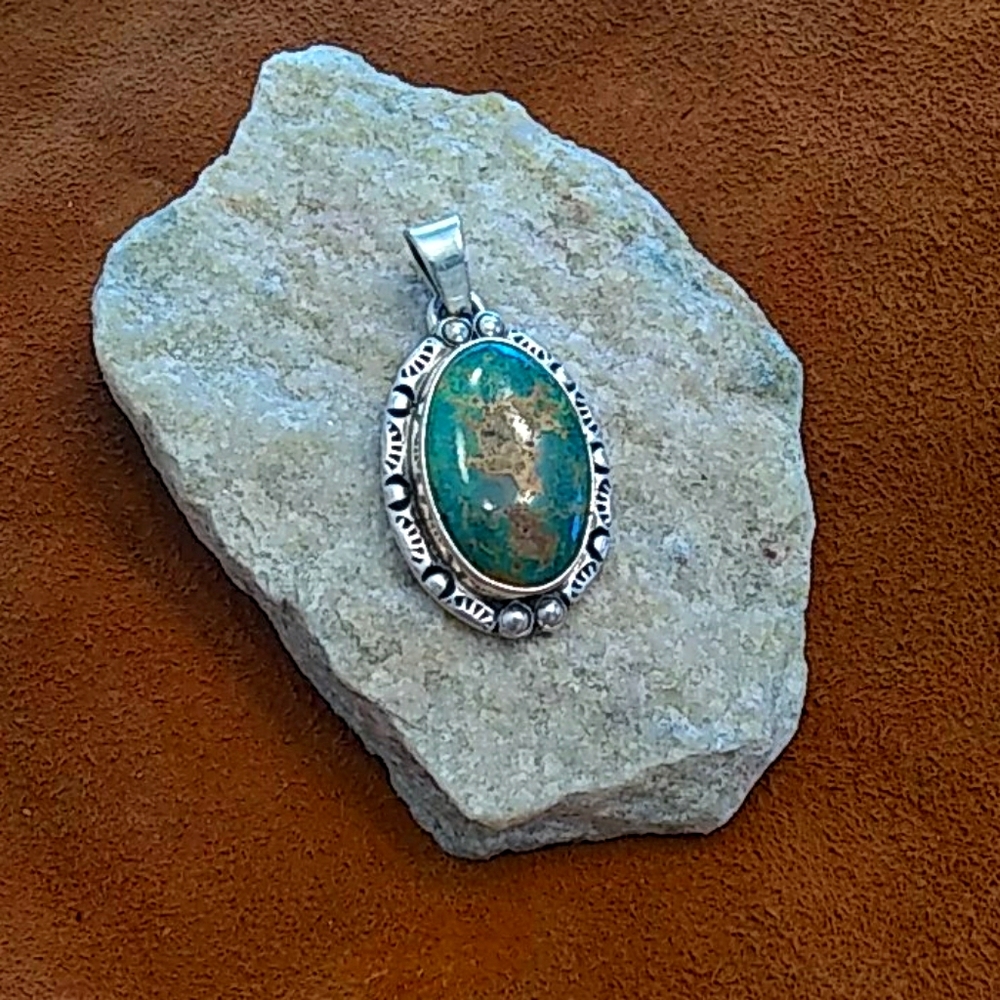Turquoise and silver pendant